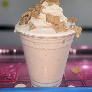 a creamy cone with whipped cream and grahams