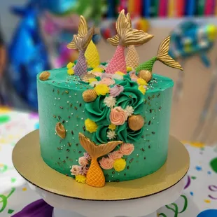 a cake with mermaid tail decorations