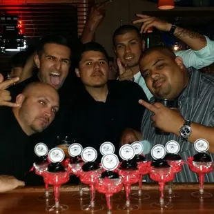 a group of men at a bar