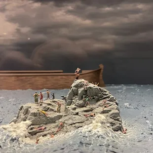 People stranded on rock during the beginning of the flood