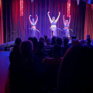 a group of performers performing on stage