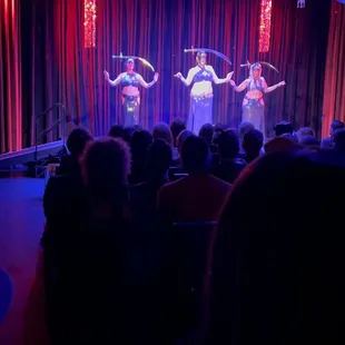 a group of performers performing on stage