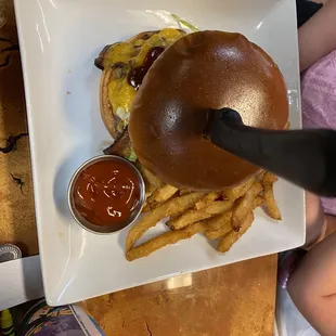 Western Burger (cheddar, pecan wood smoke bacon, onion ring, &amp; bbq sauce). $13.99