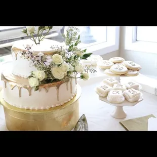 a three tiered cake with flowers on top