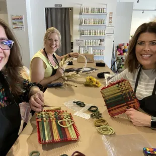 Friends showing off our Potholders and wreath.