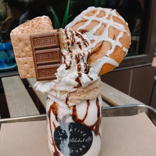 It's Lit - S'mores ,   Marshmallow, Hershey's Chocolate, Cinnamon Roll, Graham Cracker &amp; Whip Cream