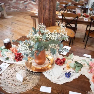 Minimalist arrangement of baby's breath, silver dollar eucalyptus, and spiral eucalyptus.