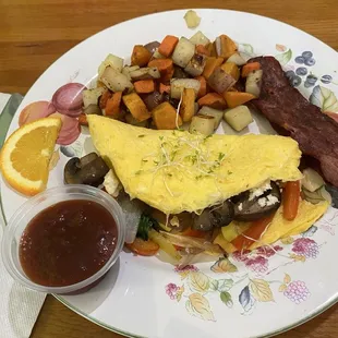 Two eggs omelette with a side of three roots .