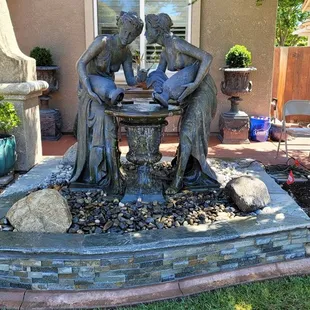 a fountain in a backyard