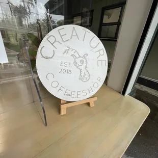 a sign in front of a window