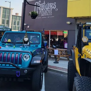 jeeps parked in front of a restaurant