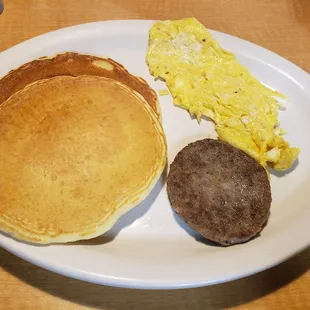 Breakfast combo. Short stack, sausage patty, and scrambled eggs.