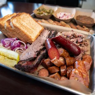 Bottom Platter - 1/2 lb. of each Sliced Brisket, Pulled Pork, Smoked Sausage, and a hot link.
