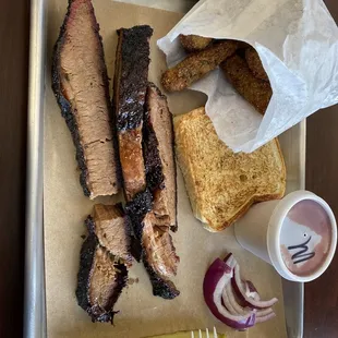 Brisket dinner included a side, whole fried okra. Mild sauce on the side. Pickle, onion and toast.