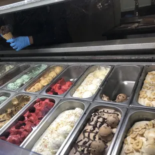 a hand holding a cone of ice cream