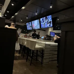 people sitting at the bar