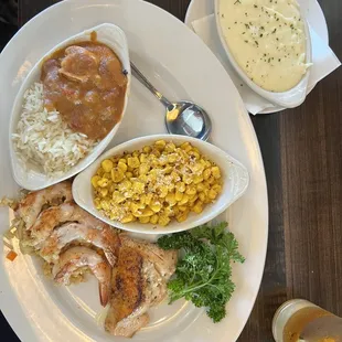 Trio plate, grilled shrimp, salmon, and étouffée is.  Side of mashed potatoes and street corn.