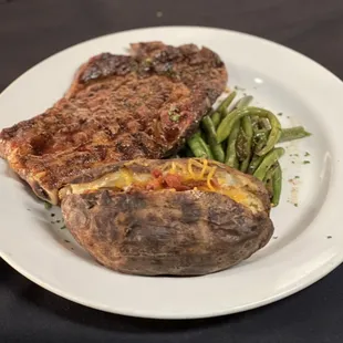 Ribeye Steak with loaded baked potato and green beans