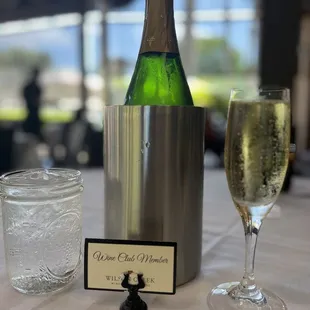 a bottle of wine and a glass of water