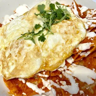 Delicious Breakfast Nachos with two Fried Eggs