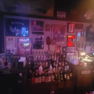 a bar with a lot of bottles of alcohol