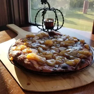 a pizza with pineapple topping