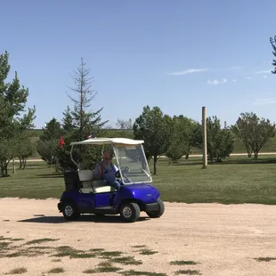 Very nice maintenance man patrols the park during the day.