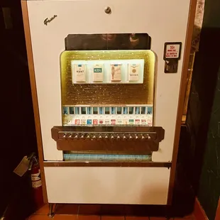 Old cigarette machine in entry
