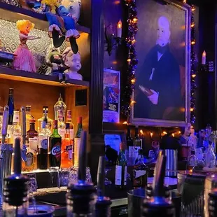 a man behind a bar counter