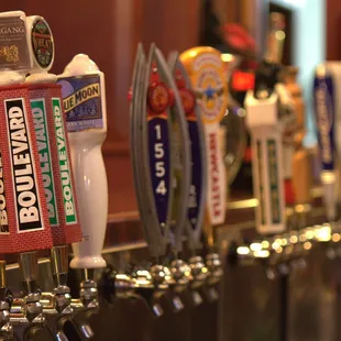 a row of beer taps
