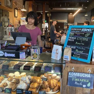 a woman behind the counter