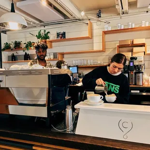 a bari serving a cup of coffee