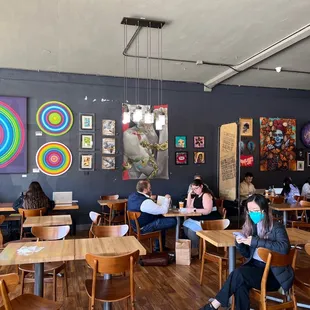 a group of people sitting at tables