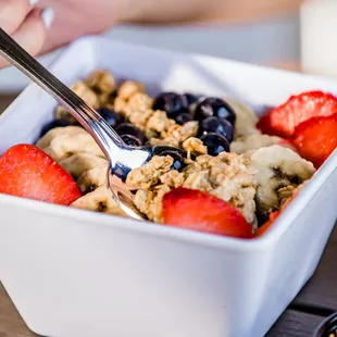 a bowl of fruit and granola