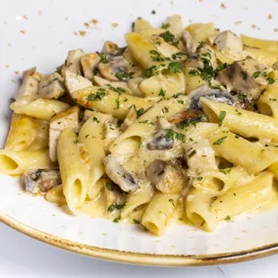 a plate of pasta with mushrooms