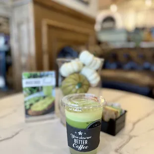 a cup of coffee on a marble table