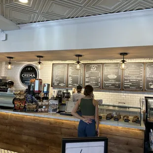 a woman standing at the counter