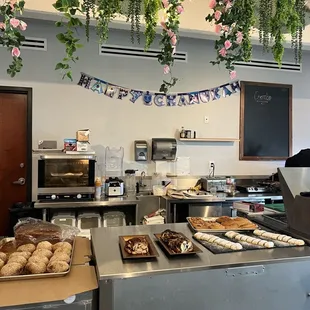 a counter with a variety of pastries