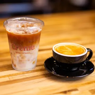a cup of coffee on a wooden table