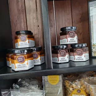 a shelf full of condiments