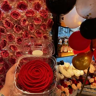 a person holding a box of roses