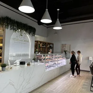 a woman standing in front of the counter