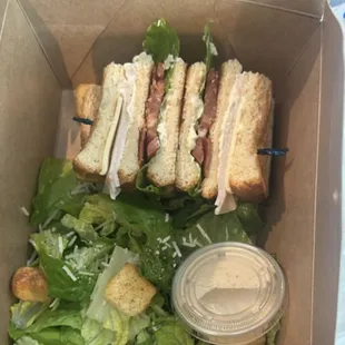 Club sandwich with a Cesar salad.