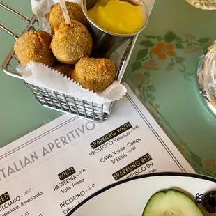 Meat-stuffed fried olives with garlic aioli