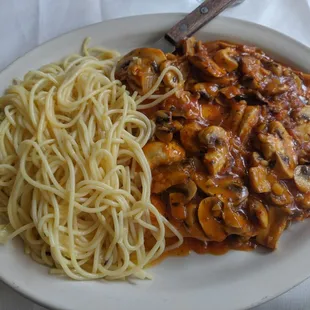 a plate of pasta and chicken