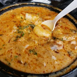 Crawfish etouffee over savory grits.