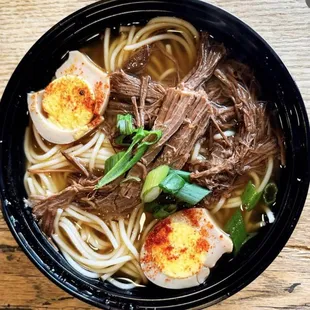 a bowl of beef and noodles