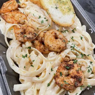 a plate of pasta and shrimp
