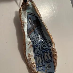 One of a kind ornament made out of oyster shell - Spanish style architecture