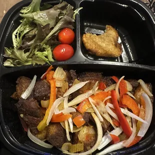 Tassot Griot (Fried Pork), black rice, Fried Plantains, and salad